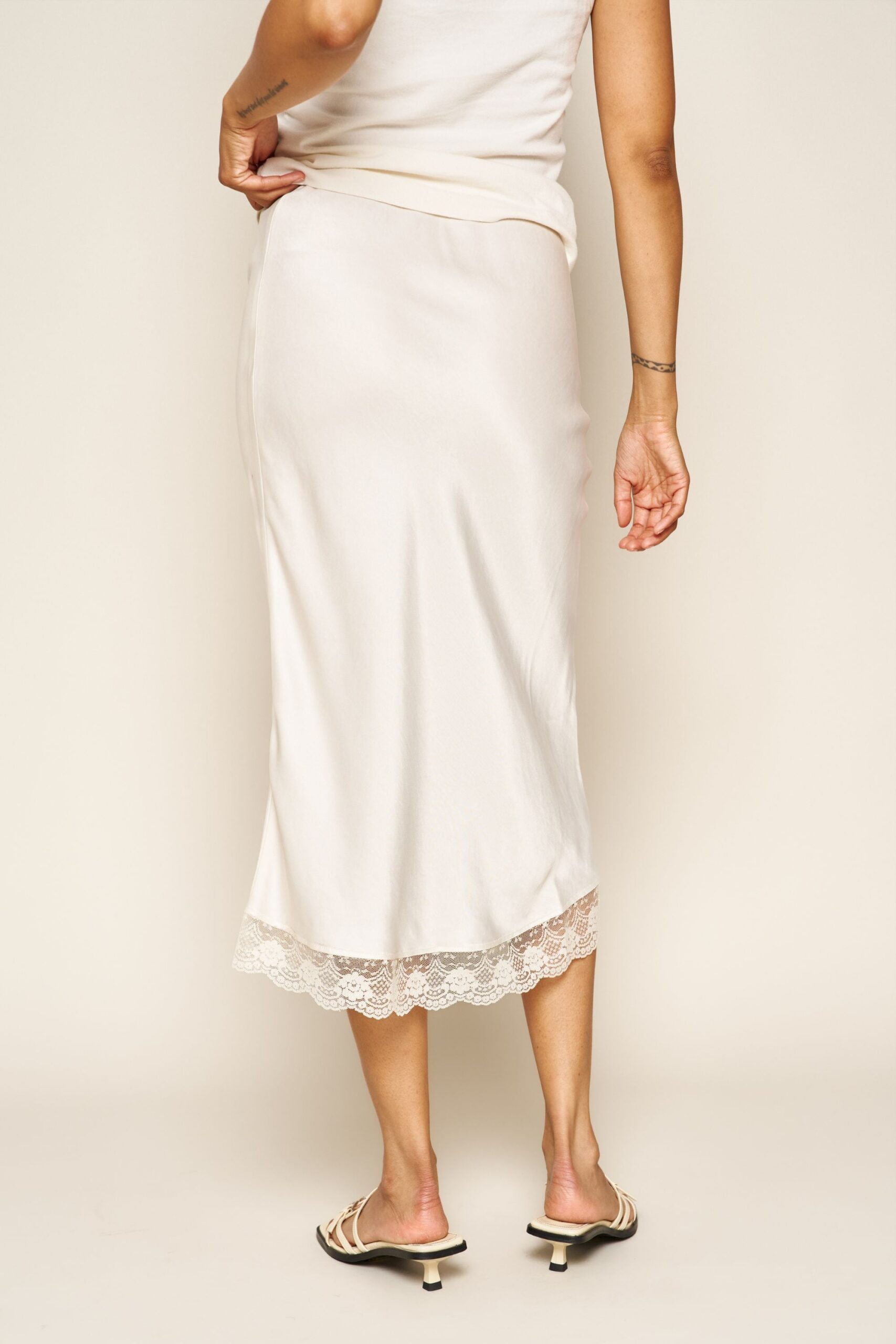 Donna-Skirt-in-silky-cream-with-lace-whimsy-and-row_jpg_749cdcfc-7848-489f-9b29-a6af8df67e22.jpg